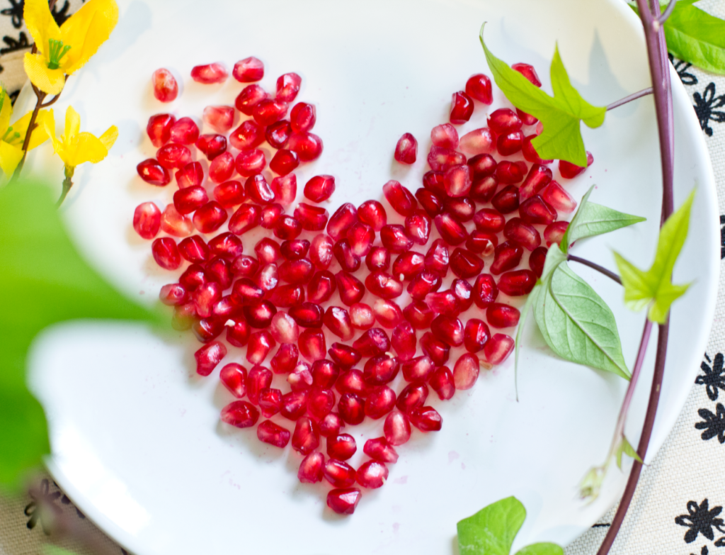 Pomegranate seeds n the shape of a heart
